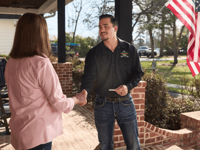 Wildlife removal specialist greeting customer